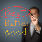 goodBetterBest Person writing on glass the words good, better, best. The word best is circled.