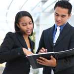 Professional man and woman working out terms of a sale